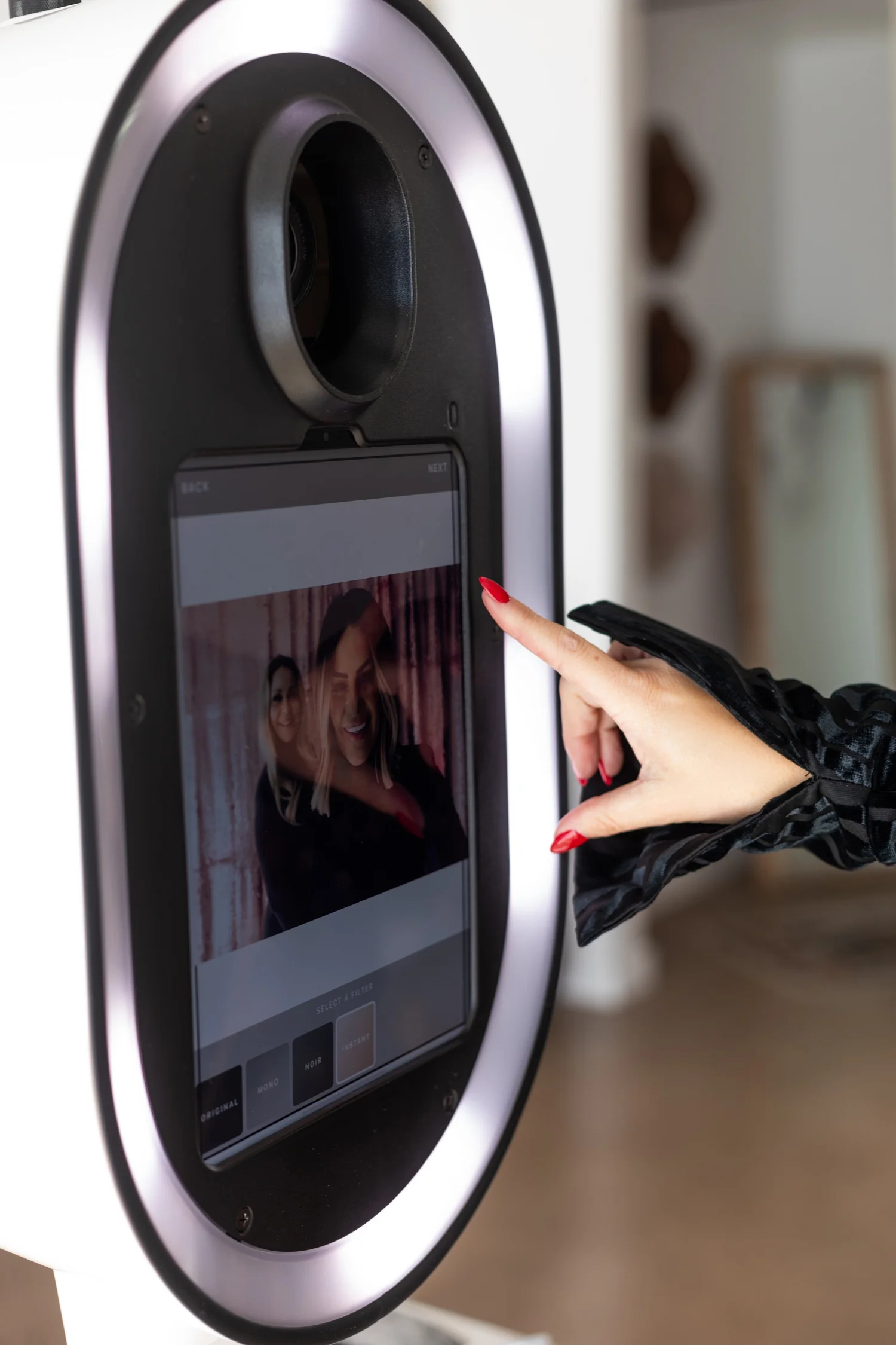 Guest using a Social Snap booth touchscreen